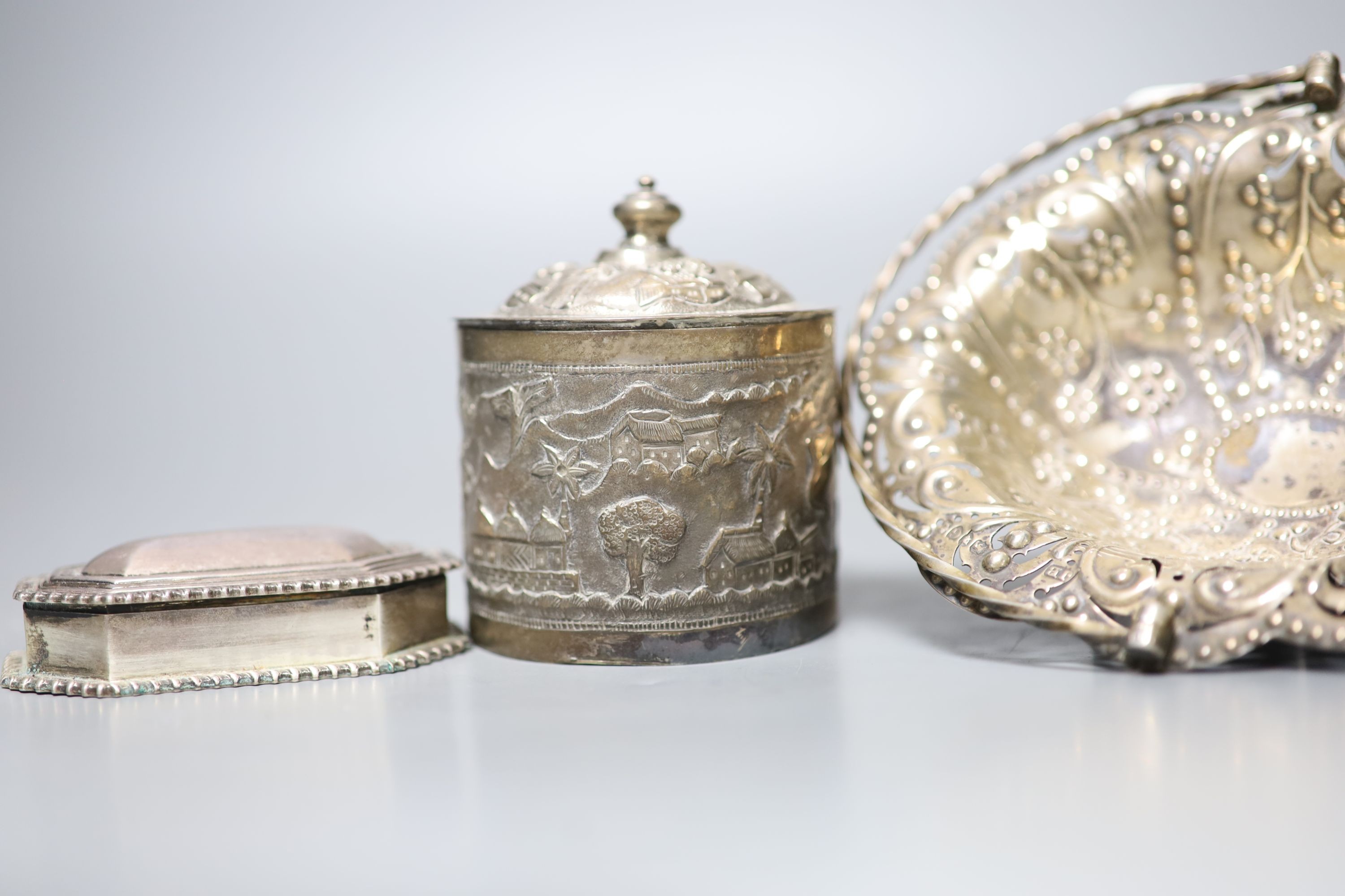 A late Victorian pierced silver basket, London, 1882, 15.7cm, a similar silver octagonal box and an Indian white metal box and cover.